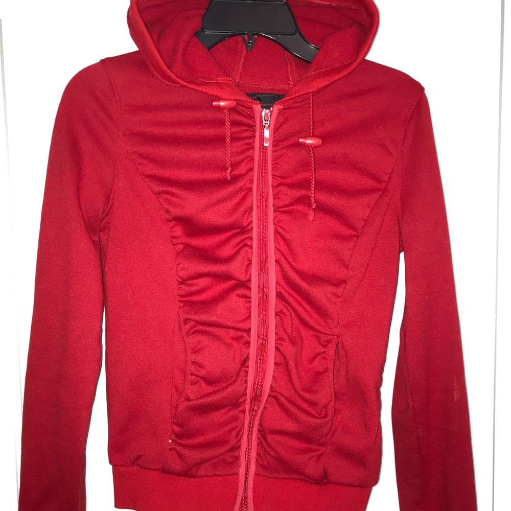 Form fitting, red sweater.